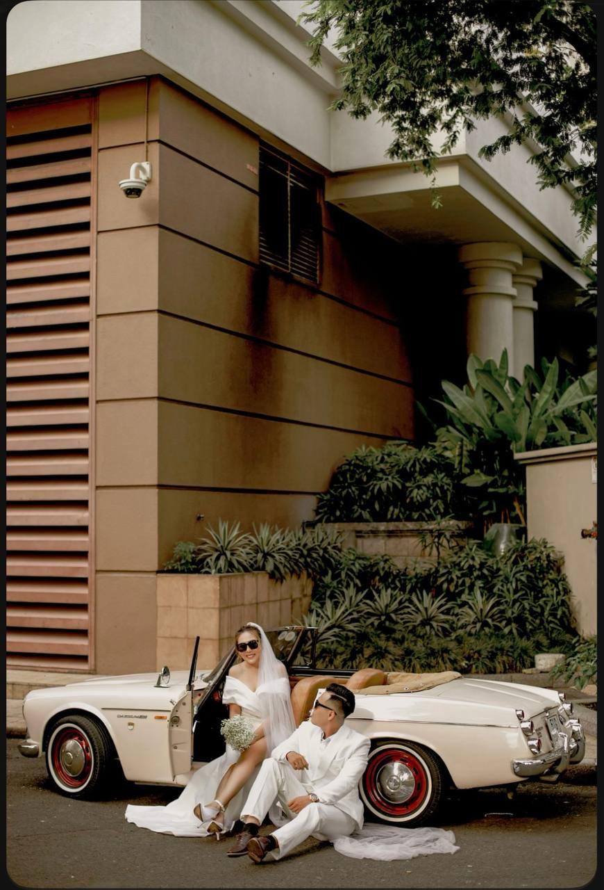 Wedding couple in classic car